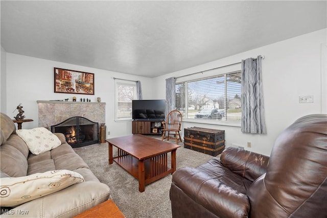 living room featuring light colored carpet and a premium fireplace