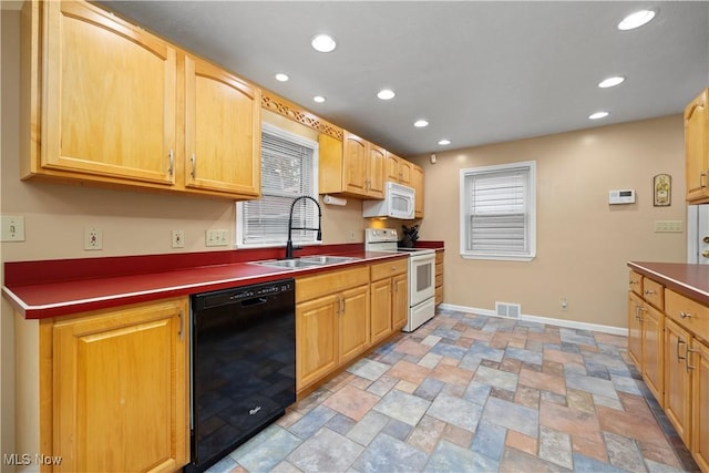 kitchen featuring white appliances and sink