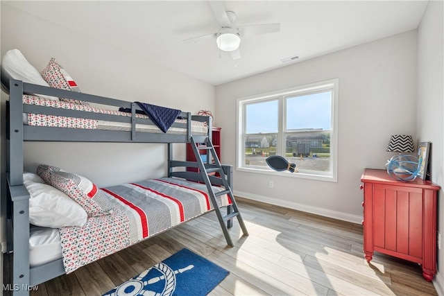 bedroom featuring ceiling fan and light hardwood / wood-style floors