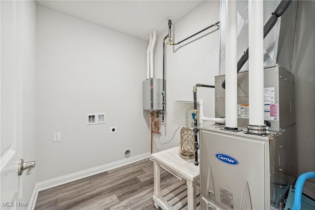 utility room with tankless water heater