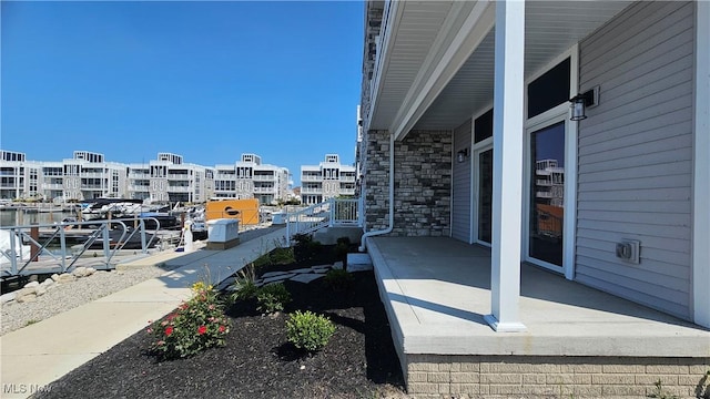 view of patio with a water view