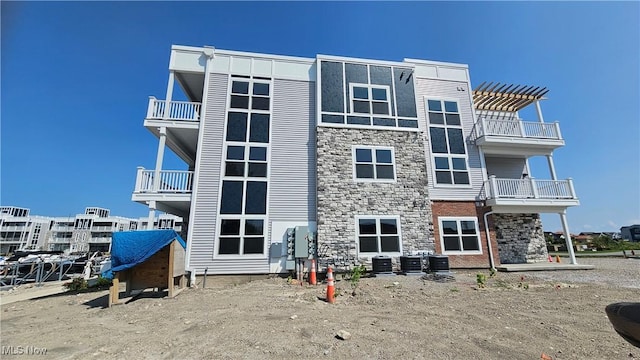 view of property featuring central AC unit