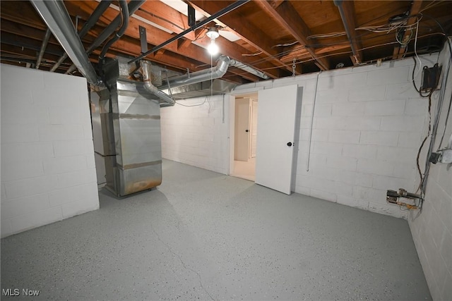 basement featuring heating unit