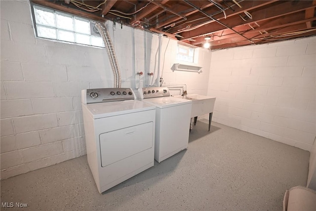 washroom featuring washer and clothes dryer and sink