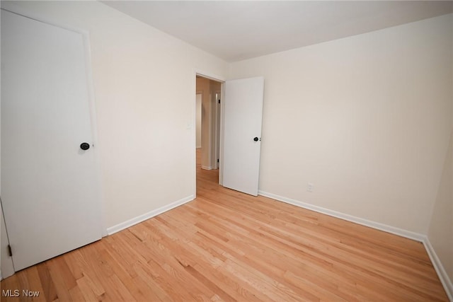 spare room with light wood-type flooring