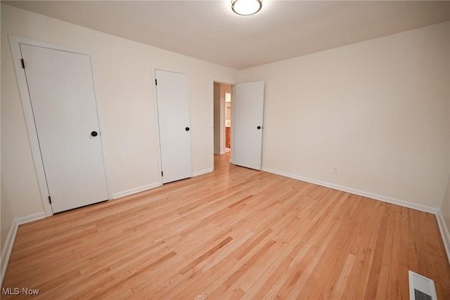 unfurnished bedroom with light hardwood / wood-style flooring