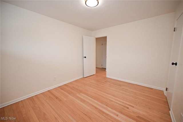 spare room with light hardwood / wood-style flooring