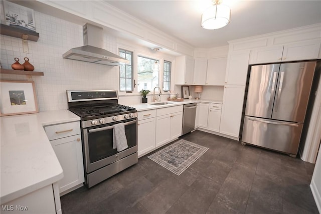 kitchen with appliances with stainless steel finishes, sink, white cabinets, backsplash, and wall chimney exhaust hood