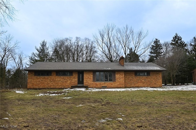 ranch-style house with a front lawn