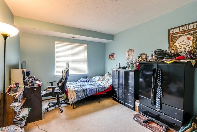 carpeted bedroom with a textured ceiling