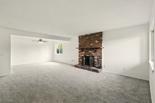 9040 Portage Pointe Dr, Streetsboro, OH 44241 - unfurnished living room featuring carpet flooring, a brick fireplace, and ceiling fan