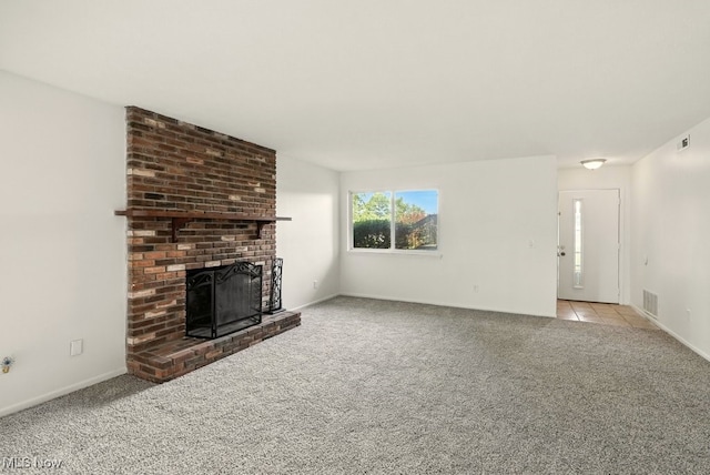 9040 Portage Pointe Dr, Streetsboro, OH 44241 - unfurnished living room with carpet floors, a fireplace, and tile patterned floors