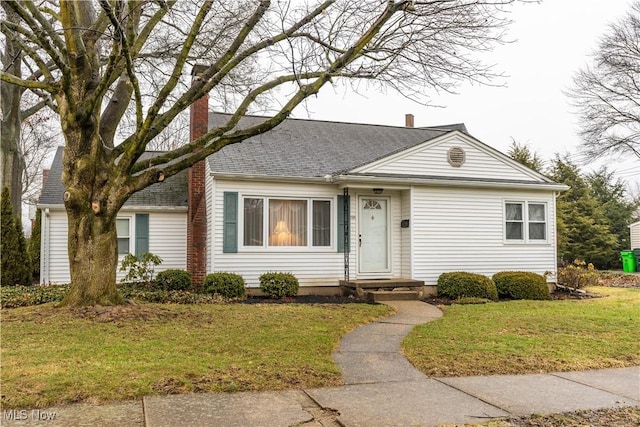 ranch-style house featuring a front lawn