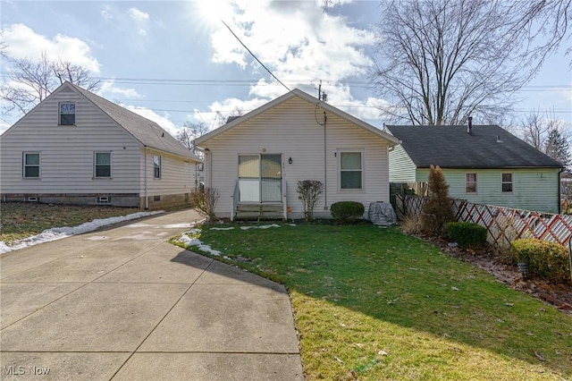 bungalow-style home featuring a front yard