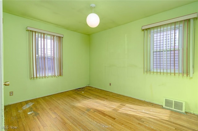 spare room with light wood-type flooring