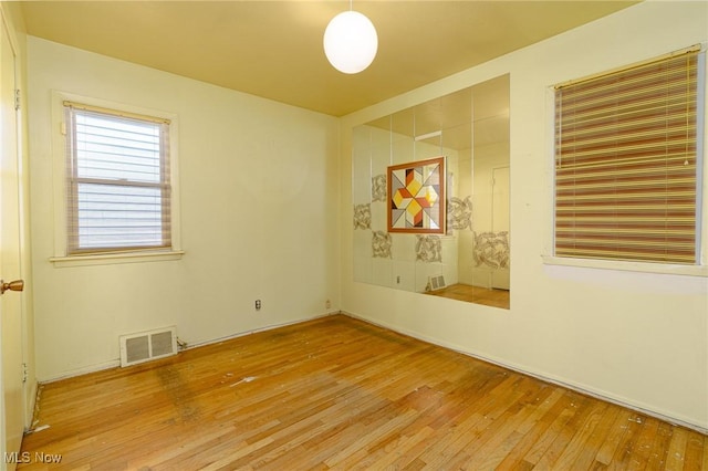 spare room featuring hardwood / wood-style flooring