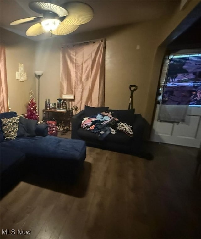 living room with hardwood / wood-style flooring and ceiling fan