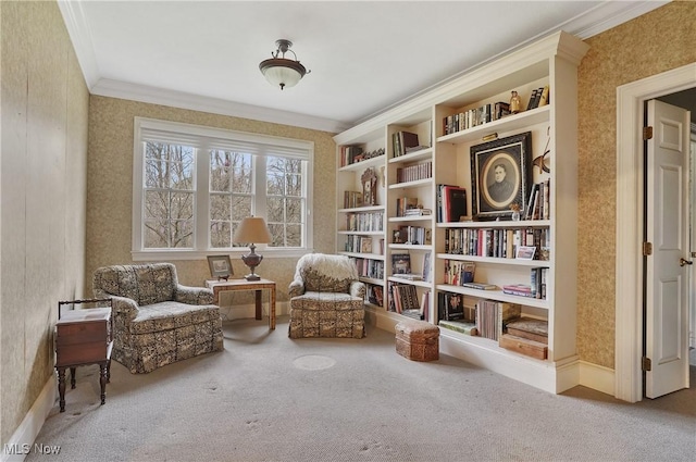 living area featuring ornamental molding and carpet