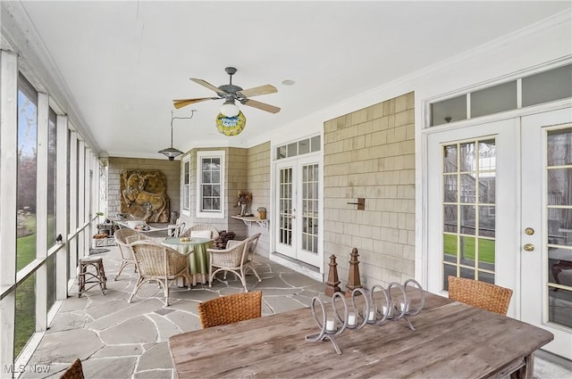 sunroom with french doors and ceiling fan