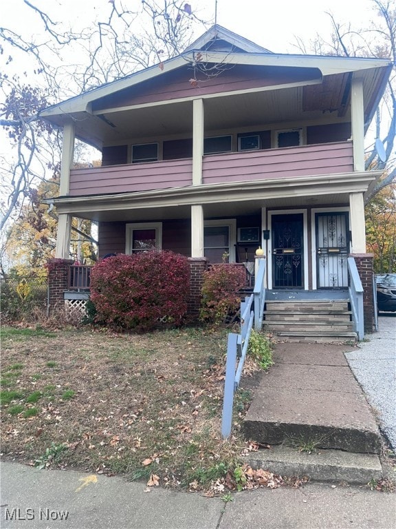 view of front of home featuring a balcony and covered porch