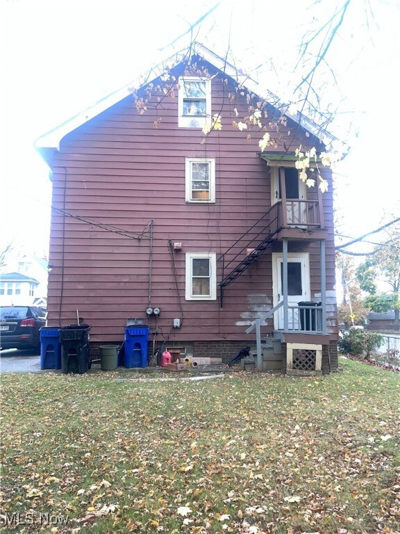 view of property exterior with a lawn