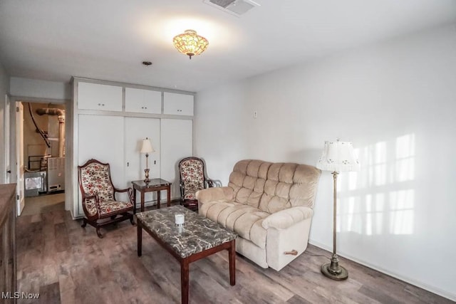 living area with hardwood / wood-style floors