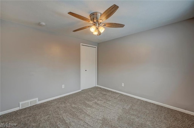 carpeted empty room with ceiling fan