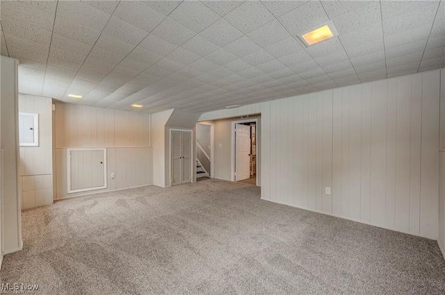 basement with carpet floors and electric panel