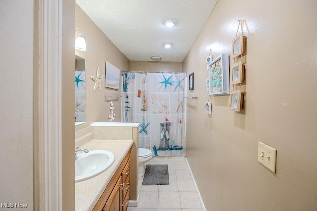 bathroom with tile patterned flooring, vanity, a textured ceiling, curtained shower, and toilet