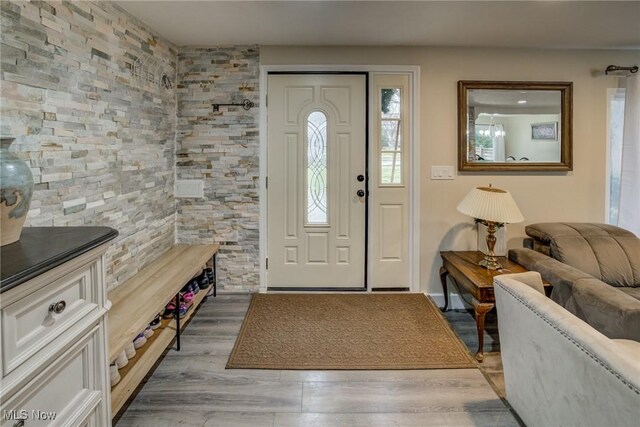 entryway with hardwood / wood-style flooring