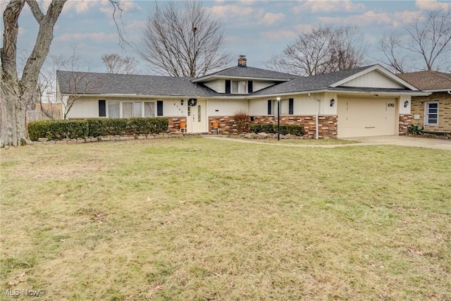 view of front of home with a garage and a front yard