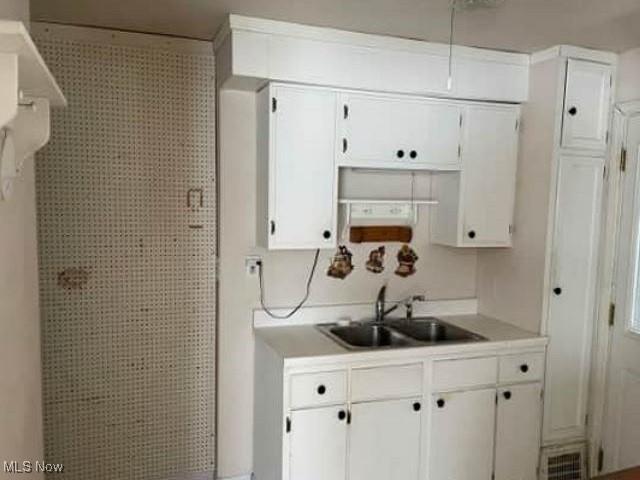 kitchen with sink and white cabinets