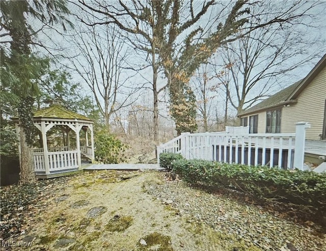 view of yard featuring a gazebo and a wooden deck