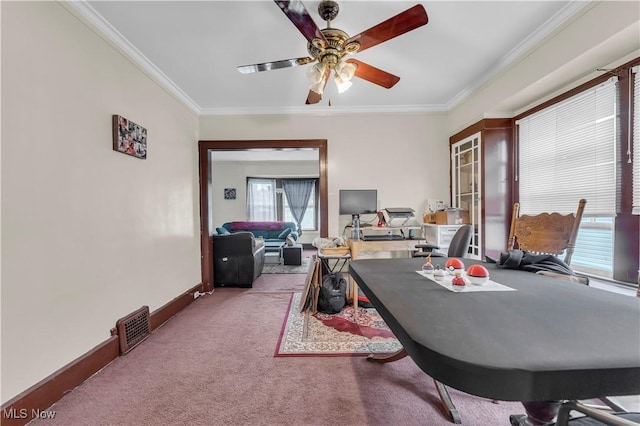 office area with light carpet, crown molding, and ceiling fan