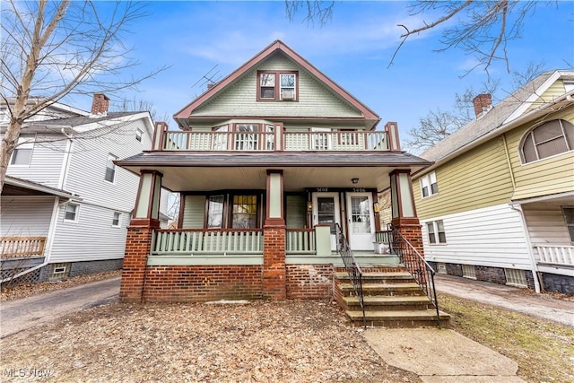 view of front of house with a porch and a balcony