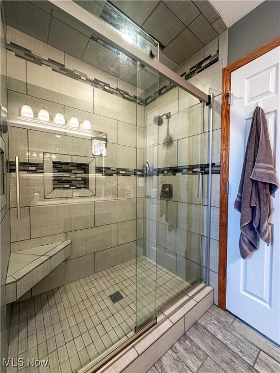 full bathroom with a shower stall