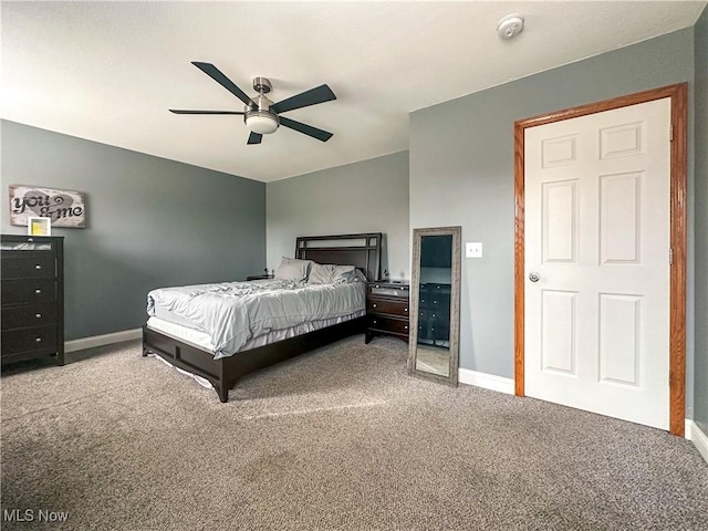 bedroom with carpet floors, lofted ceiling, baseboards, and a ceiling fan