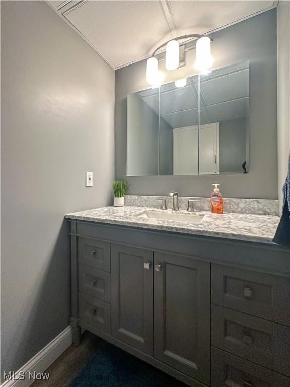 bathroom featuring vanity and baseboards