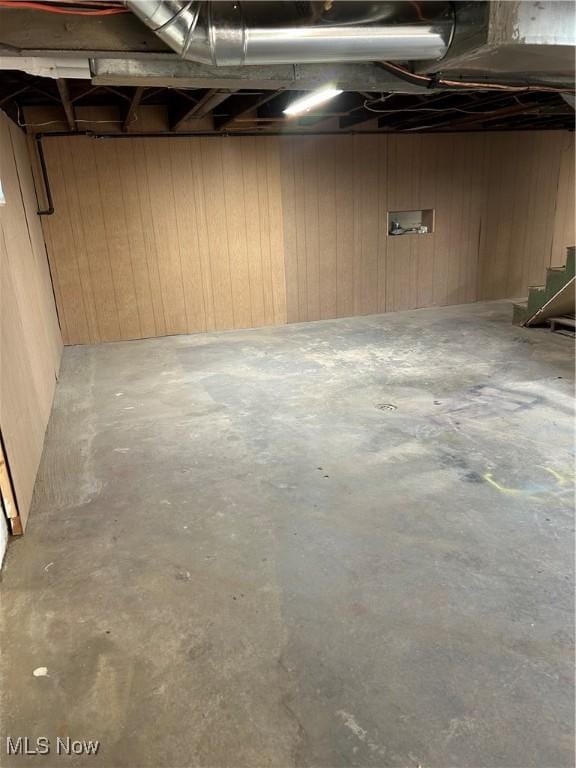 basement with wood walls