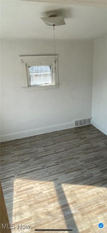 empty room featuring hardwood / wood-style floors