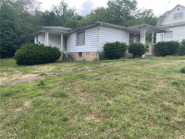 view of property exterior featuring a lawn