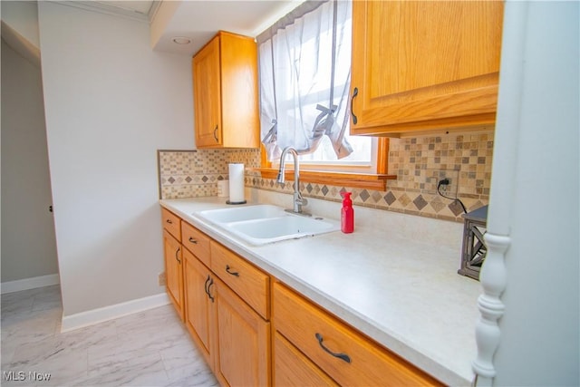 kitchen featuring tasteful backsplash and sink