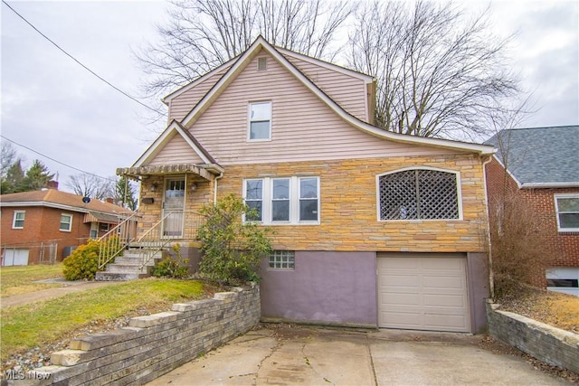 view of front of property with a garage