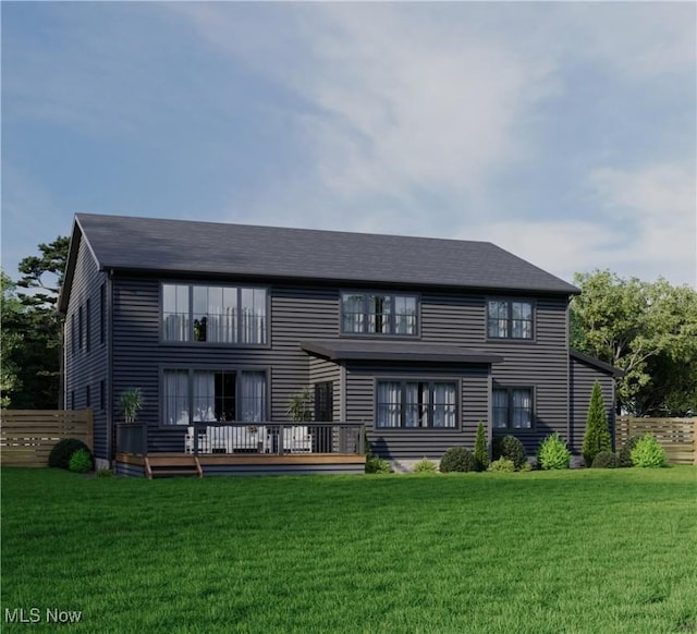 rear view of house featuring a deck and a lawn