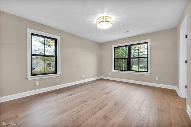 unfurnished room featuring light wood-type flooring