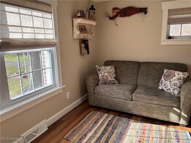 living room with dark hardwood / wood-style flooring