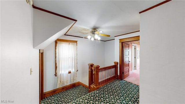 hall featuring crown molding and carpet