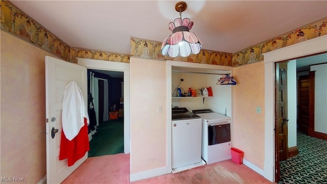 laundry area with light colored carpet and washing machine and dryer