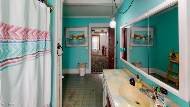 bathroom with vanity, crown molding, and a shower with shower curtain