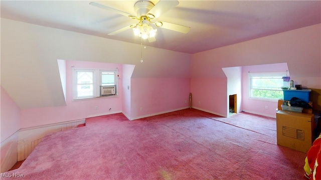 additional living space featuring vaulted ceiling, light carpet, ceiling fan, and cooling unit